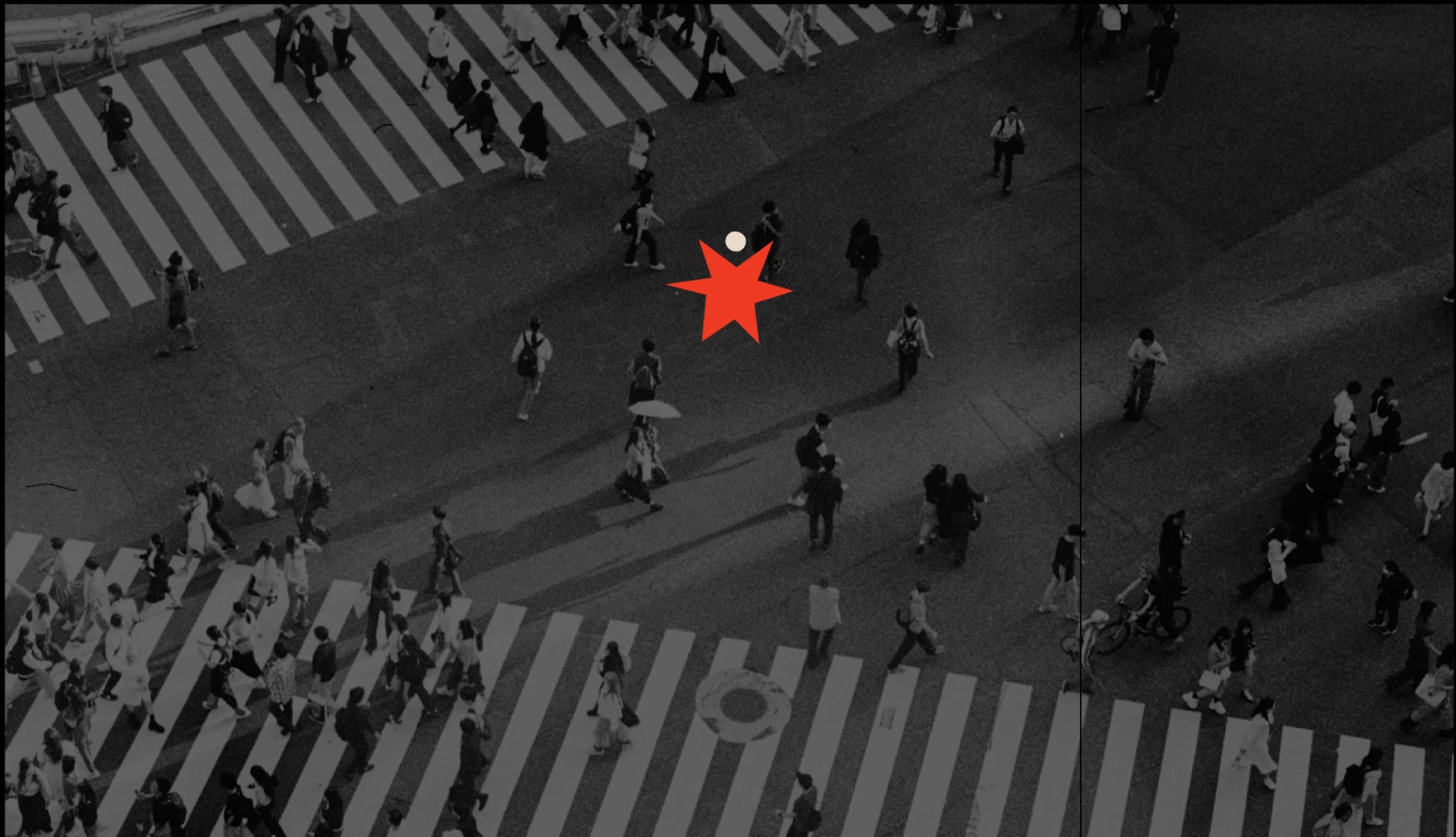 Pedestrians crossing a city intersection at night